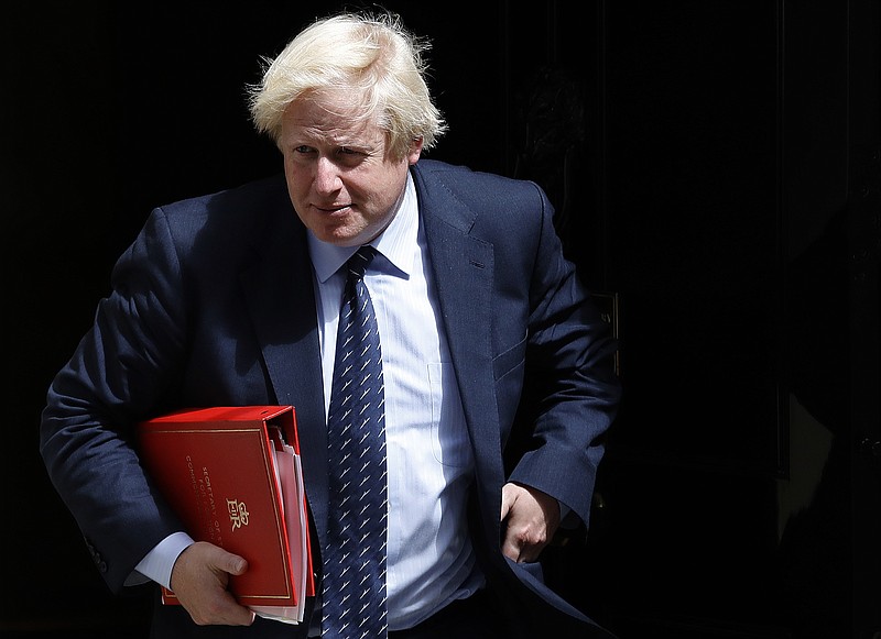 FILE - Britain's Foreign Secretary Boris Johnson leaves a cabinet meeting at 10 Downing Street after the general election in London, Tuesday, June 13, 2017. The British government is facing a Thursday deadline to hand over a sheaf of former Prime Minister Boris Johnsons personal messages to the countrys COVID-19 pandemic inquiry. (AP Photo/Frank Augstein, File)