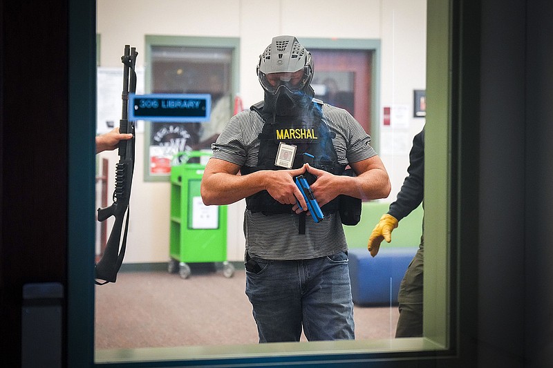 A school marshal participates in a school safety active shooter training demonstration conducted by the Texas Commission on Law Enforcement in summer 2022 at Walsh Middle School in Round Rock. The event demonstrated training given to school police departments to handle active shooter situations and provide information on the school marshal plan, a program that allows staff to carry a firearm on campus. Texas lawmakers response to the Uvalde school shooting is to mandate armed personnel on every campus. (Smiley N. Pool/Dallas Morning News/TNS)