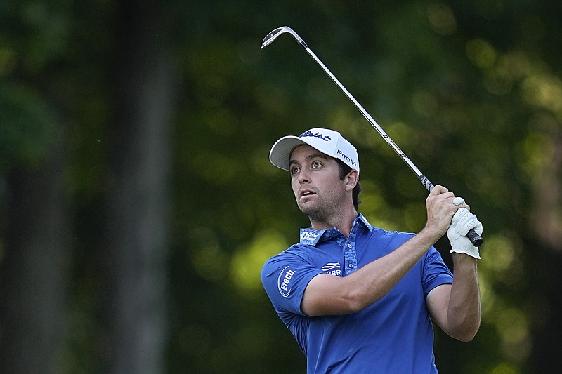 Davis Riley watches his shot to the ninth green during the first round of the Memorial golf tournament Thursday, June 1, 2023, in Dublin, Ohio. (AP Photo/Darron Cummings)