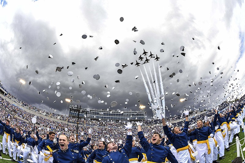 Air Force Cadets toss their caps in the air as the Thunderbirds fly overhead during the United States Air Force Academy graduation ceremony Thursday at Air force Academy, Colo.
(AP /John Leyba)