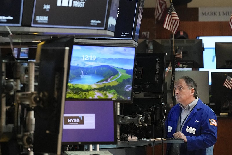 Traders work on the floor at the New York Stock Exchange in New York, Friday, June 2, 2023. (AP Photo/Seth Wenig)