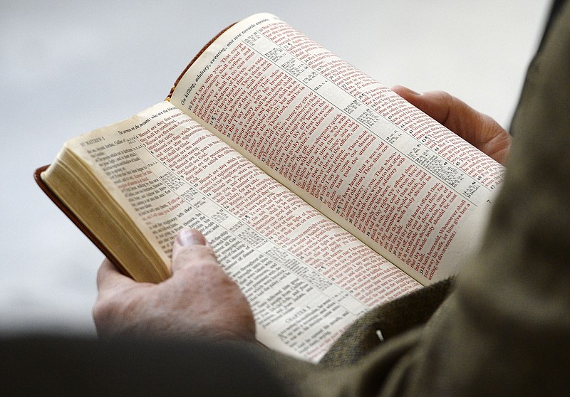 The Bible is read aloud at the Utah Capitol, Monday, Nov. 25, 2013. The Bible has been banned at elementary and middle schools in the Davis School District north of Salt Lake City, after a review committee decided it wasn't age appropriate "due to vulgarity or violence." (Steve Griffin/The Salt Lake Tribune via AP)