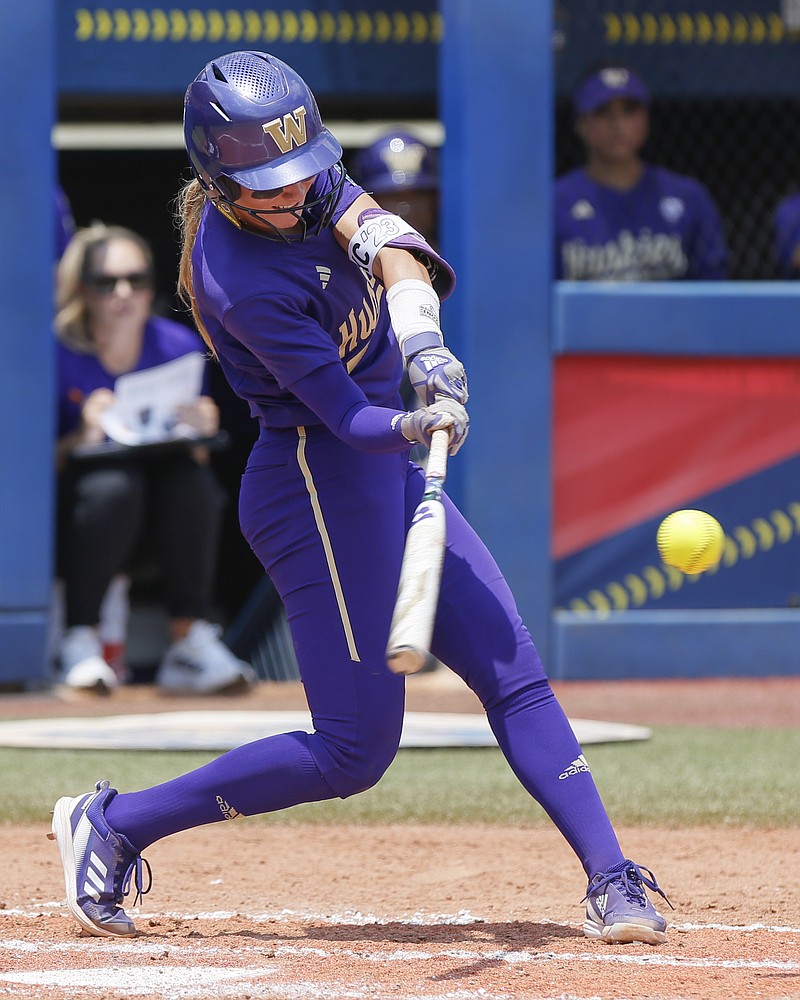 Washington's Rylee Holtorf hits a home run against Utah during the second inning of an NCAA softball Women's College World Series game Friday, June 2, 2023, in Oklahoma City. (AP Photo/Nate Billings)