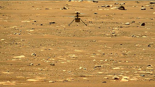 In this image made available by NASA, the Mars Ingenuity helicopter hovers above the surface of the planet during its second flight on Thursday, April 22, 2021. (NASA/JPL-Caltech/ASU/MSSS via AP)