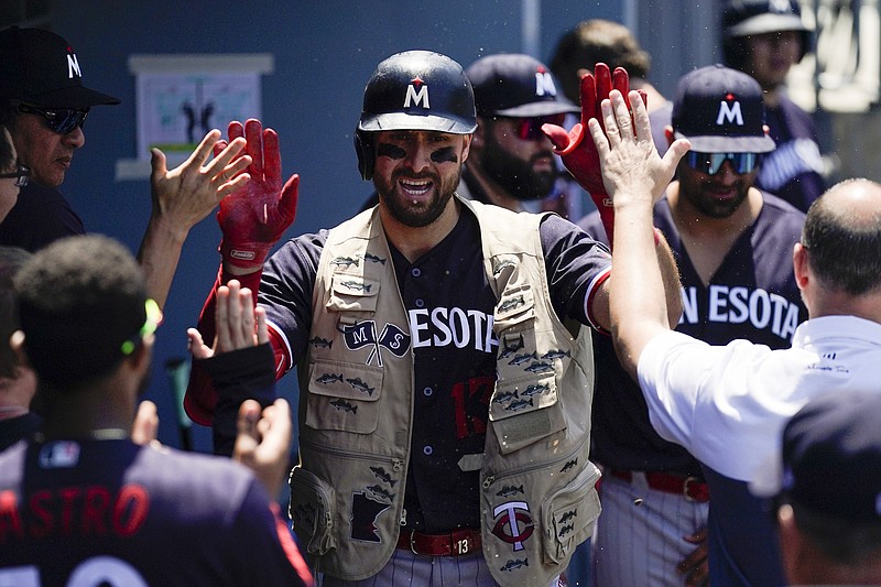 Minnesota Twins' Joey Gallo (13) celebrates after hitting a home run during the sixth inning of a baseball game against the Los Angeles Dodgers in Los Angeles, Wednesday, May 17, 2023. (AP Photo/Ashley Landis)