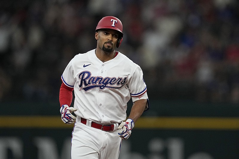 Texas Rangers' Leody Taveras sprints around third during a