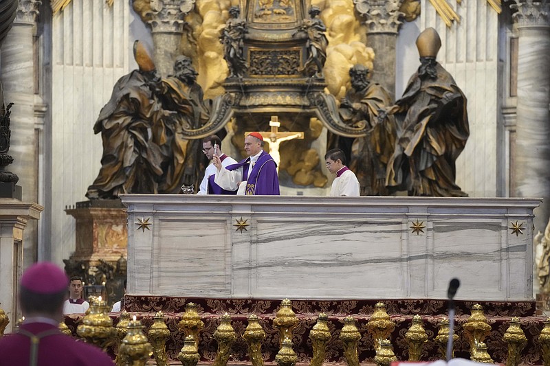 CORRECTS CARDINAL NAME - Cardinal Mauro Gambetti, center, blesses the altar of the confession during a penitential rite inside St. Peter's Basilica, Saturday, June 3, 2023. (AP Photo/Gregorio Borgia)
