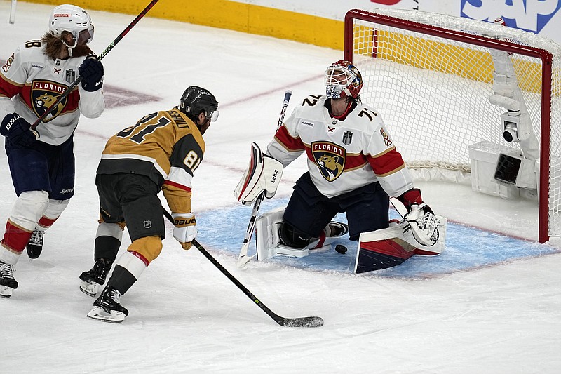 Vegas Golden Knights right wing Jonathan Marchessault (81) watches as a goal by defenseman Zach Whitecloud slips past Florida Panthers goaltender Sergei Bobrovsky (72) during the third period of Game 1 of the NHL hockey Stanley Cup Finals, Saturday, June 3, 2023, in Las Vegas. (AP Photo/Abbie Parr)