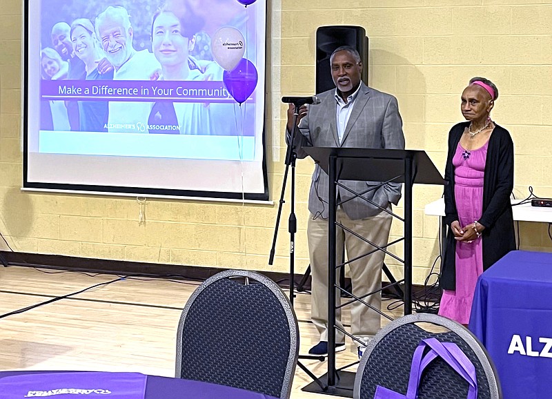 Mario Browne speaks at the Pittsburgh Summit on Alzheimer's and Dementia in the African American Community as his mother, Joyce Browne, stands next to him June 1, 2023, in Pittsburgh. Mario Browne is the associate dean for equity, engagement and justice at the University of Pittsburgh and an associate professor of pharmacy and therapeutics. "My mother has always been my hero," he said. (Hanna Webster/Pittsburgh Post-Gazette/TNS)