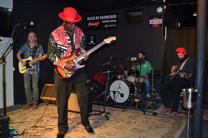 Port City Blues Society guitarist Mark Morgan (left) joined 'Blues Blueblood' Kent Burnside along with drummer Jacob Best and bassist Colin Best for Saturday night's Blues by Budweiser concert series at RJ's Sports Bar & Grill. (Special to The Commercial/Richard Ledbetter)