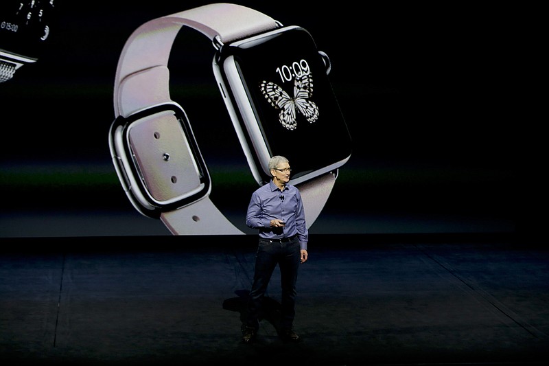 File - Apple CEO Tim Cook discusses the Apple Watch at the Apple event at the Bill Graham Civic Auditorium in San Francisco, Wednesday, Sept. 9, 2015. If Apple unveils a widely anticipated headset equipped with mixed reality technology on Monday, it will be the company's biggest new product since the introduction of the Apple Watch nearly a decade ago. (AP Photo/Eric Risberg, File)