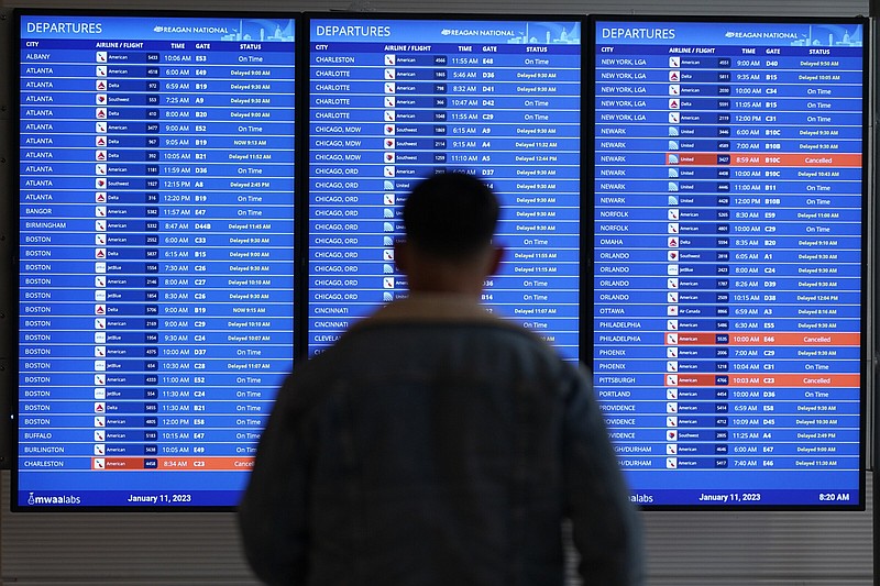 A traveler looks at a flight board with delays and cancellations at Ronald Reagan Washington National Airport on Wednesday, in Arlington, Va. Congressional investigators said in a report at the end of April that an increase in flight cancellations as travel recovered from the pandemic was due mostly to factors that airlines controlled, including cancellations for maintenance issues or lack of a crew. 
(AP/Patrick Semansky)