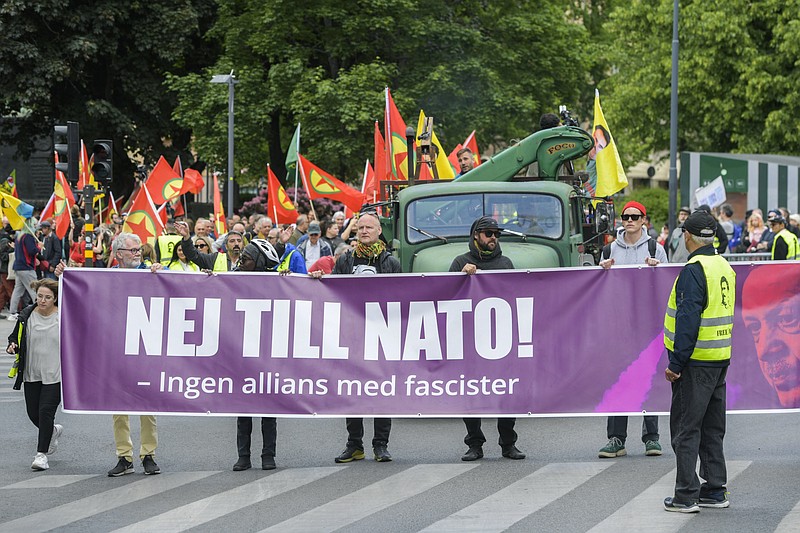 The Alliance against NATO network take part in a demonstration in support of democratic forces in Turkey and against Swedish NATO membership, in Stockholm, Sunday June 4, 2023. Hundreds of people, including dozens of pro-Kurdish protesters, gathered in Stockholm to demonstrate against Swedens planned NATO membership. They rallied under the banner of the “Alliance Against NATO,” an umbrella for a mix of Kurdish organizations, leftist groups, anarchists, youth and climate activists and people opposed to Swedens new anti-terror laws, which took effect on June 1, as well as those calling for free media. (Maja Suslin/TT News Agency via AP)