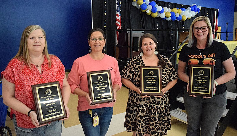 Mike Eckels/Special to the Eagle Observer Four classified and certified staff members and teachers were presented with classified/certified staff of the year awards during the end of the 2022-23 school year catfish fry in the cafeteria at Decatur High School on May 25. Teachers and staff members receiving the awards included Gina Holt (left), Jose Lucio, Samantha Beck and Courtney Pearson.