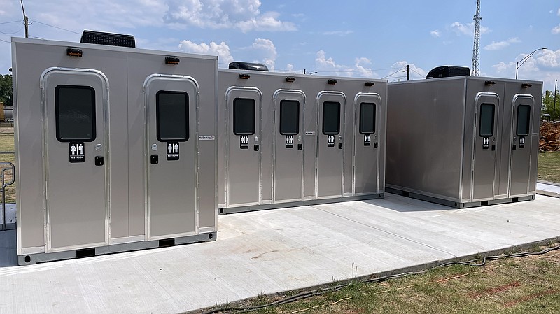 A group of new restroom stalls are seen Friday, June 2, 2023, at Front Street Festival Plaza in Texarkana, Arkansas. The city and its Advertising and Promotion Commission together allocated $534,000 for these stalls and others to accommodate the public during large-scale events in the plaza. AMS Global of De Queen, Arkansas, manufactured the restrooms, which have water, sewer and electric connections and will be climate-controlled. Other work on the plaza — to be funded by a $650,000 bond issue — includes a roofed scaffolding structure around the plazas stage, fencing around the area and traffic control measures. (Staff photo by Karl Richter)