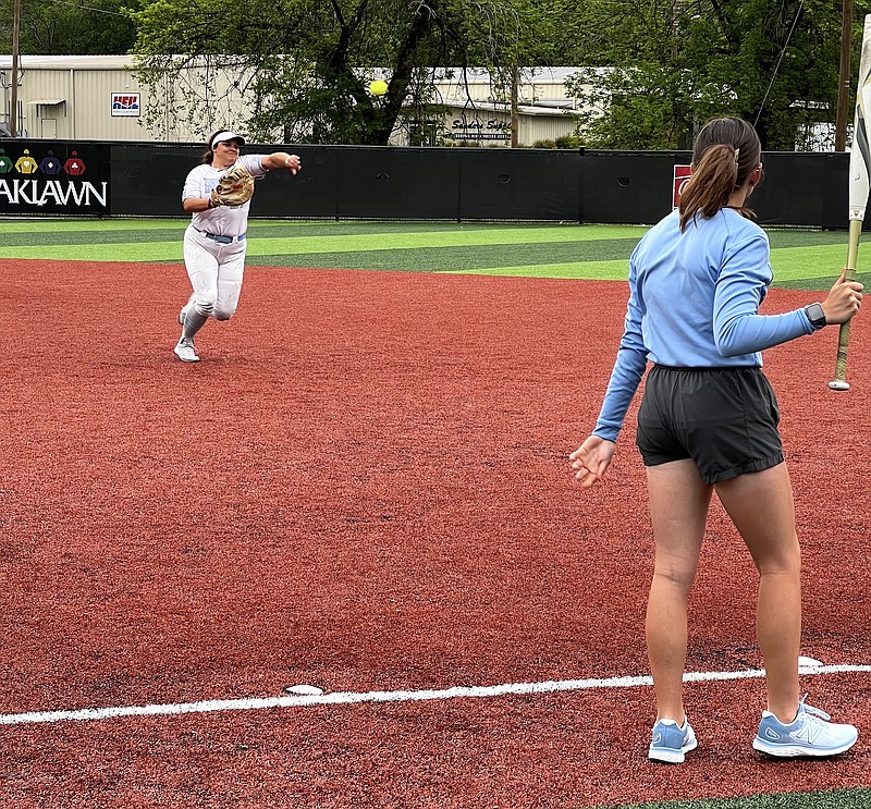 An NPC softball player takes ground ball drills before a college softball game on Hank Aaron Field at Majestic Park on April 30. NPC is hosting its annual Elite Prospect Camp today at Hank Aaron Field. - Photo by Bryan Rice of The Sentinel-Record