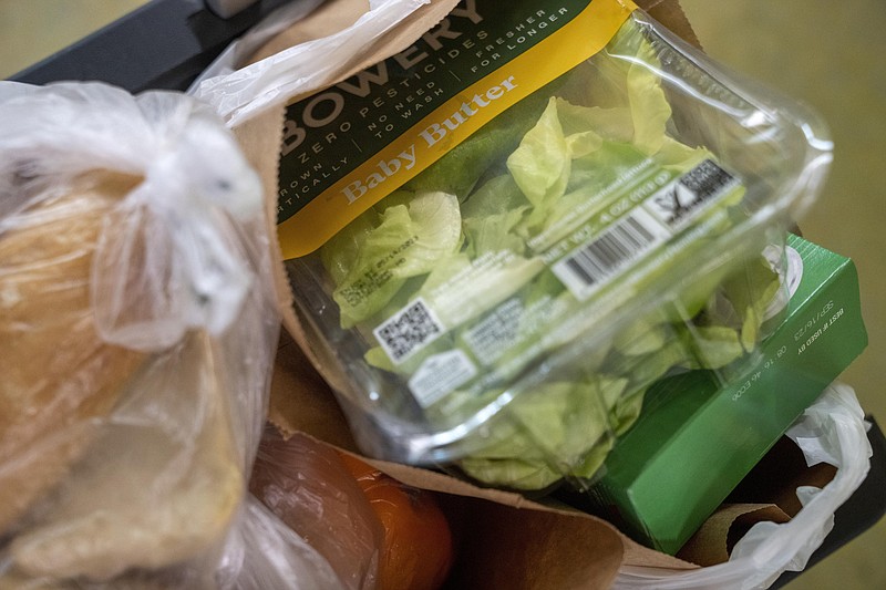 Multiple school districts and food bank partners are offering meals and bagged food for children out of school for the summer. (AP Photo/Jacquelyn Martin)