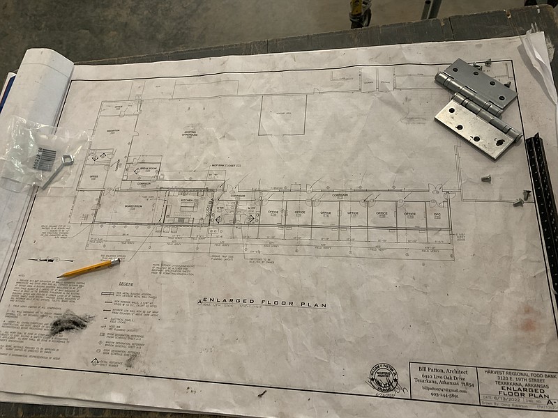 A blueprint of Harvest Regional Food Bank's new expansion that will include a commercial kitchen, community education room and office space, is seen Tuesday, June 6, 2023, in Texarkana, Arkansas. (Staff photo by Mallory Wyatt)