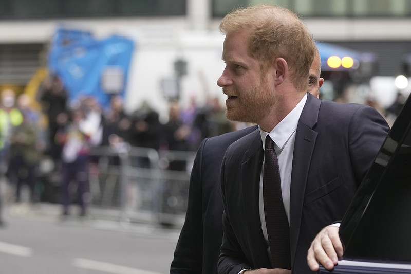 Prince Harry arrives at the High Court in London, Tuesday, June 6, 2023. Prince Harry is due at a London court to testify against a tabloid publisher he accuses of phone hacking and other unlawful snooping. Harry alleges that journalists at the Daily Mirror and its sister papers used unlawful techniques on an "industrial scale" to get scoops. Publisher Mirror Group Newspapers is contesting the claims. (AP Photo/Kin Cheung)