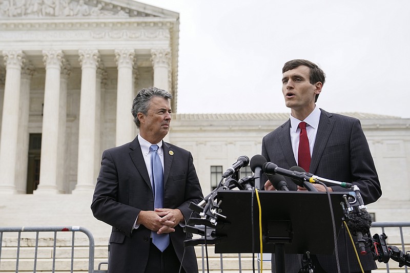 FILE - Alabama Solicitor General Edmund LaCour, right, speaks alongside Alabama Attorney General Steve Marshall following oral arguments in Merrill v. Milligan, an Alabama redistricting case that could have far-reaching effects on minority voting power across the United States, outside the Supreme Court on Capitol Hill in Washington, Oct. 4, 2022. (AP Photo/Patrick Semansky, File)