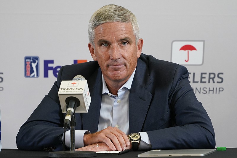 FILE - PGA Tour Commissioner Jay Monahan speaks during a news conference before the start of the Travelers Championship golf tournament at TPC River Highlands, Wednesday, June 22, 2022, in Cromwell, Conn. The most disruptive year in golf ended Tuesday, June 6, 2023, when the PGA Tour and European tour agreed to a merger with Saudi Arabia's golf interests, creating a commercial operation designed to unify professional golf around the world.(AP Photo/Seth Wenig, File)