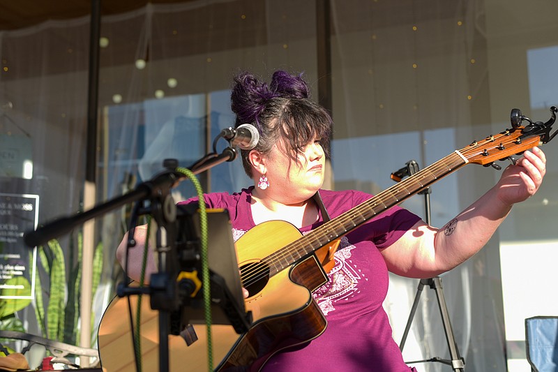 Nicci McCarty tunes her guitar in preparation for her band's performance during Downtown Live on Friday, June 10, 2022, in Texarkana. (Staff file photo by Erin DeBlanc)