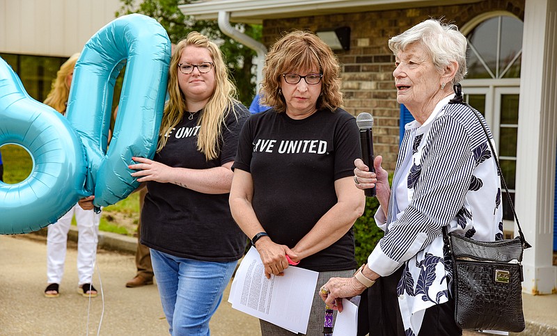 Julie Smith/News Tribune photo: 
Marylyn DeFeo, near, addresses the group gathered to celebrate the 30th anniversary of the Unmet Needs Committee Wednesday, June 7, 2023, at the United Way of Central Missouri office. The Jefferson City Area Chamber of Commerce hosted a ribbon cutting to mark the event before the June meeting. Standing with Samaritan Center Executive Director and founding member of unmet needs DeFeo are, United Way of Central Missouri Vice President Theresa Verslues, middle, and Kerrie DeLaney, UWCEMO administrative coordinator.