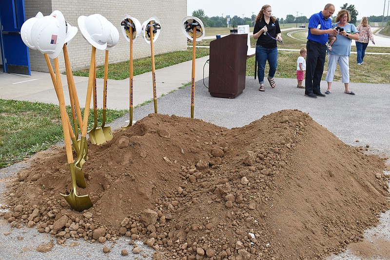 Garrett Fuller/News Tribune photo: Dirt, shovels and hard hats are seen Wednesday, June 7, 2023, at the site of Russellville High School's new addition after the groundbreaking ceremony. The parking lot on the west side of the school will eventually become eight new classrooms for the school, which is at capacity. GBH Builders, general contractor for the project, estimates the project to be complete in time for the 2024-25 school year.