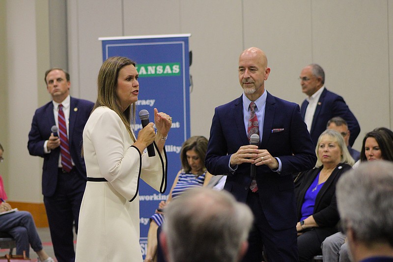 As Arkansas Sec. of Education Jacob Oliva looks on, Gov. Sarah Huckabee Sanders speaks during a town hall meeting held Tuesday evening at the El Dorado Conference Center on the LEARNS Act, her signature education bill. (Caitlan Butler/News-Times)