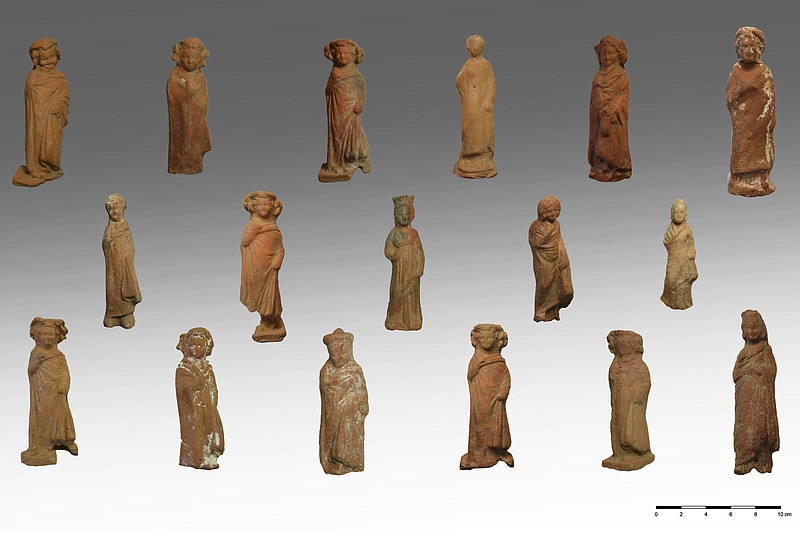 In this undated photo released by the Greek Culture Ministry, on Wednesday, June 7, 2023, clay figurines of boys and girls found during an excavation on the Greek island of Kythonos. Archaeologists excavating a hilltop sanctuary on the Aegean Sea island of Kythnos have discovered “countless” pottery offerings left there by ancient worshippers over the centuries, Greece's Culture Ministry said Wednesday, June 7, 2023. (Greek Culture Ministry via AP)