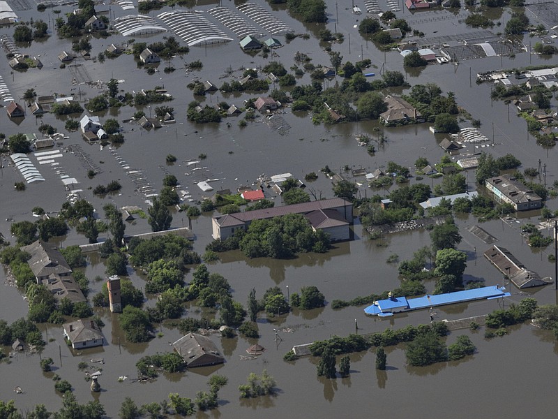 CAPTION CORRECTS LOCATION - Houses are seen underwater in the flooded village of Dnipryany, in Russian-occupied Ukraine, Wednesday, June 7, 2023, after the collapse of Kakhovka Dam. (AP Photo)