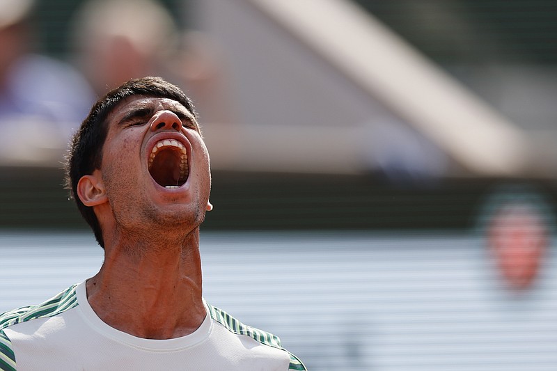 Spain's Carlos Alcaraz reacts after winning the second set against Serbia's Novak Djokovic during their semifinal match of the French Open tennis tournament at the Roland Garros stadium in Paris, Friday, June 9, 2023. (AP Photo/Jean-Francois Badias)