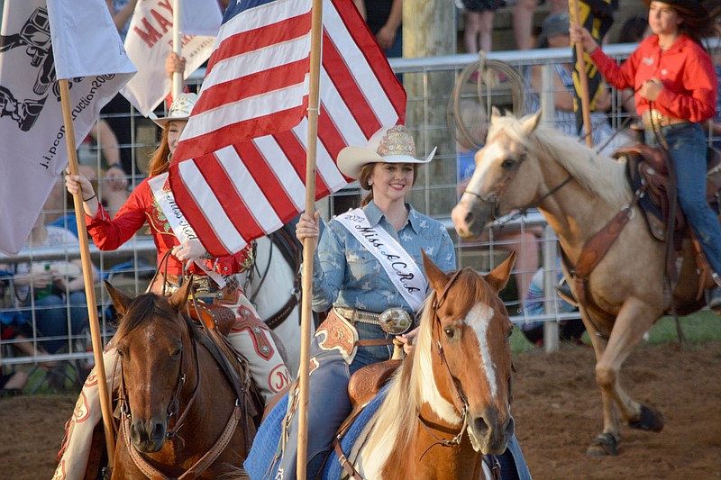 Graham Thomas/Herald-Leader
ACRA Rodeo Queen Chelsey Grimes rides with the American Flag at the 2022 Siloam Springs Rodeo. The 2023 Siloam Springs Rodeo is set to begin Thursday at the Siloam Springs Rodeo Grounds.