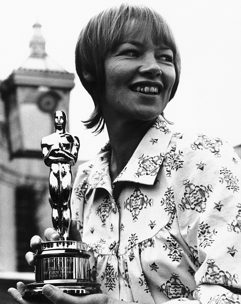 FILE - British actress Glenda Jackson holds her Oscar award which she won for her performance in the film 'Women in love', after she was presented with it in April 1971 in London by Hal B. Wallis, a member of the board of governors of the motion picture academy of arts and sciences. Glenda Jackson, a double Academy Award-winning performer who had a long second career as a British lawmaker, has died at 87. Jackson's agent Lionel Larner said she died Thursday, June 15, 2023 at her home in London after a short illness. (AP Photo/Robert Dear, File )