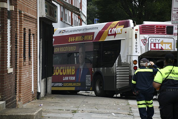 16 injured as Baltimore bus crashes into cars apartment building 16 injured as Baltimore bus crashes into cars apartment building