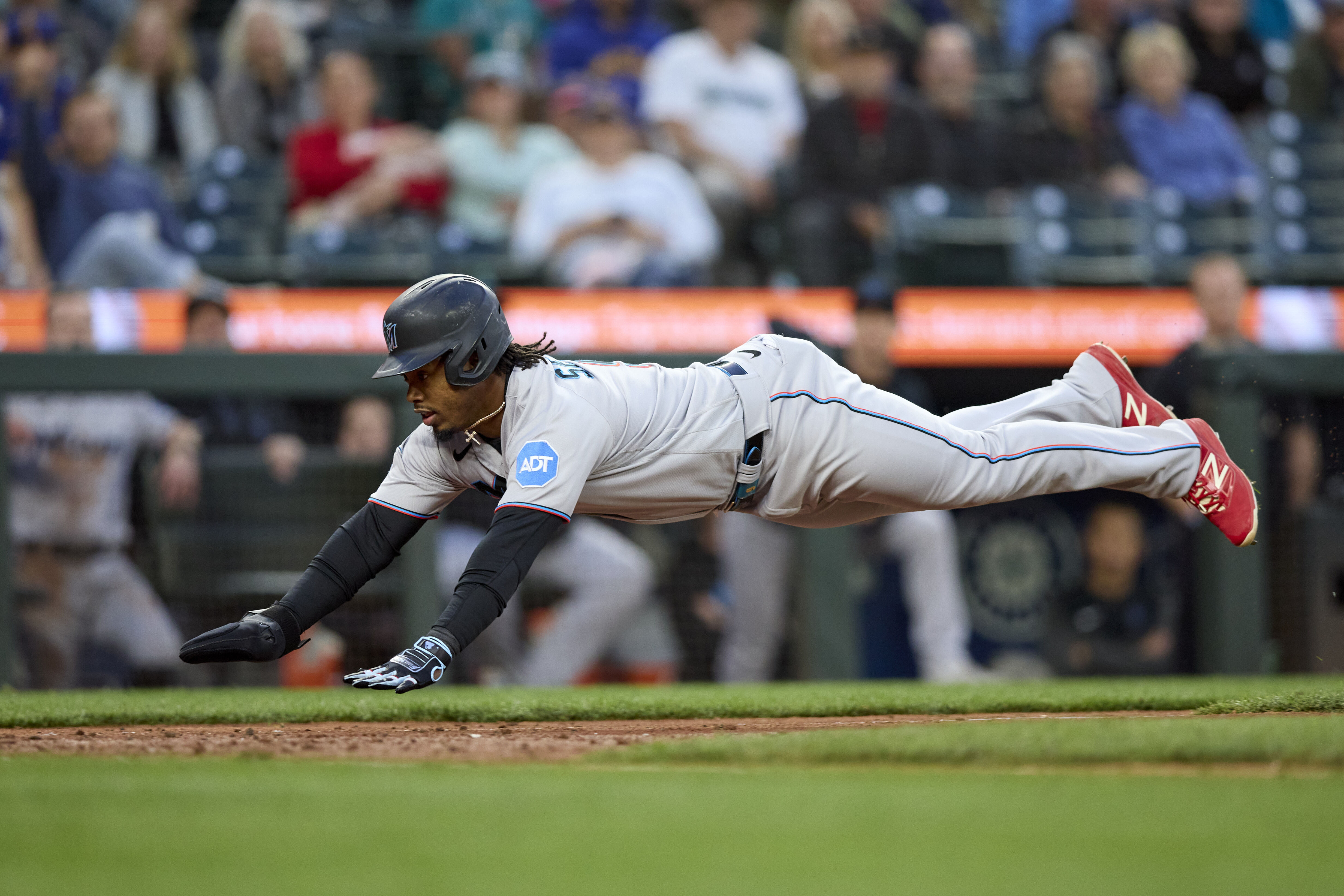 Miami Marlins baseball infielder Jean Segura puts on a Marlins