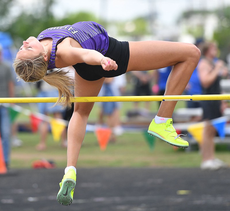Ava Goetz of Fayetteville leaps Thursday, May 18, 2023, while competing in the high jump portion of the heptathlon at the Arkansas High School Decathlon and Heptathlon in Fayetteville. (NWA Democrat-Gazette/Andy Shupe)