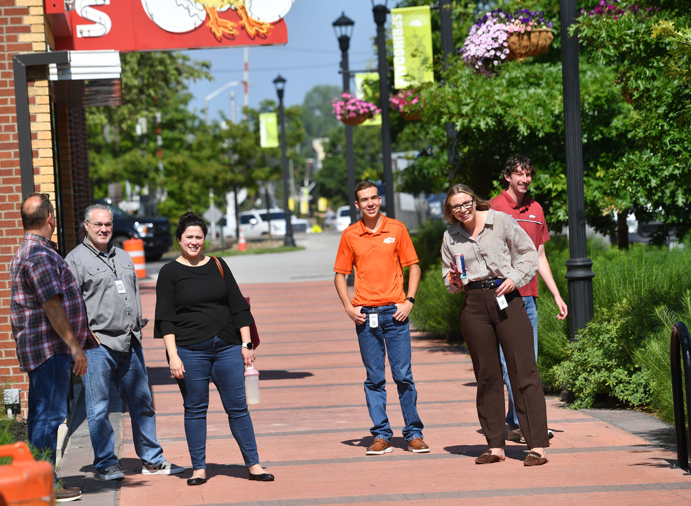 Cowboys drive horses through Springdale's Emma Avenue for rodeo