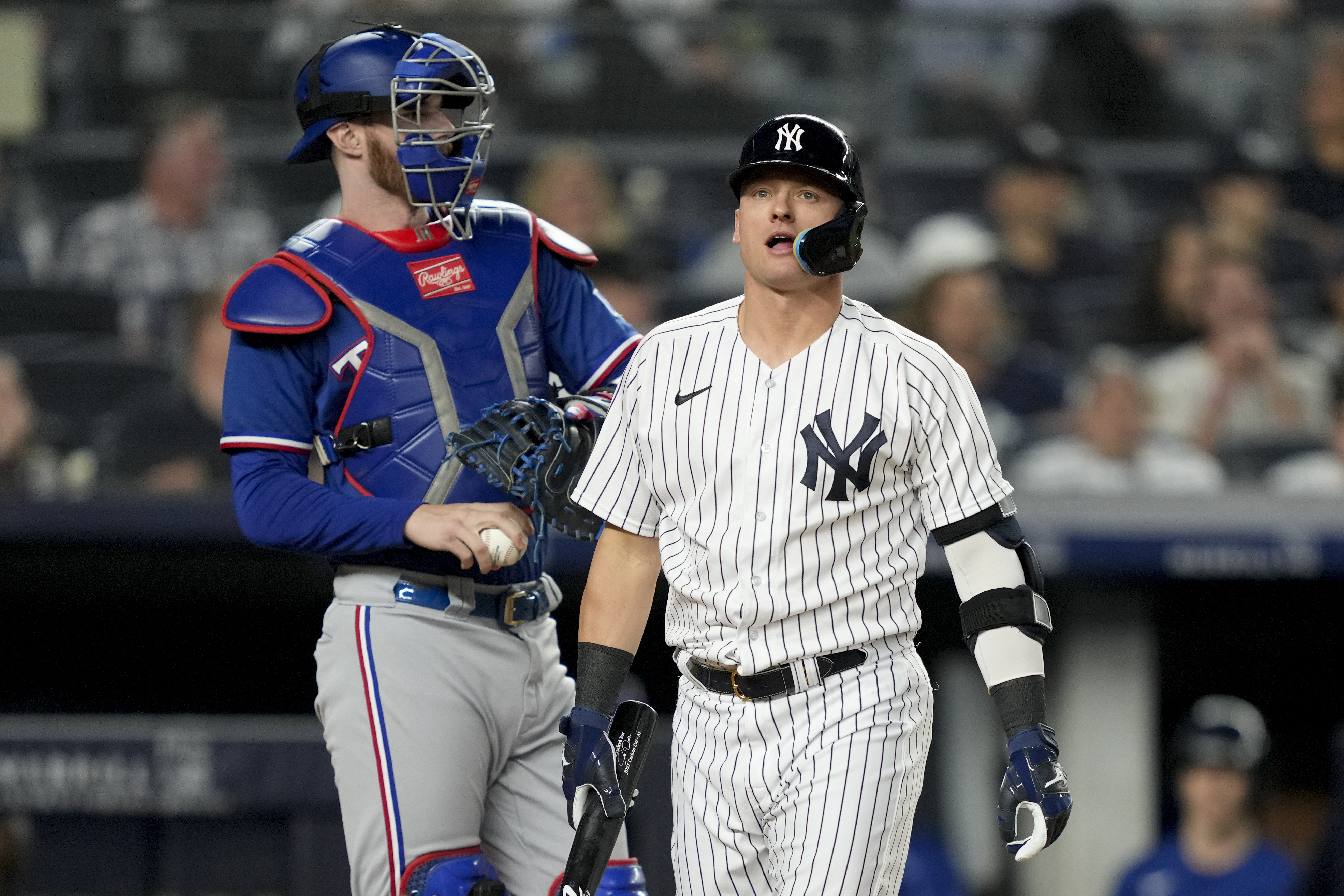 Texas Rangers' Mitch Garver runs to first after hitting an RBI single  against the New York Yankees during the eighth inning of a baseball game  Friday, June 23, 2023, in New York. (