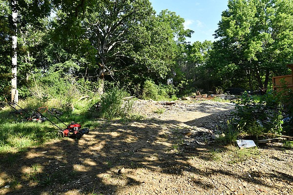 Residents council members come together to help remove dilapidated home in southeast Fayetteville