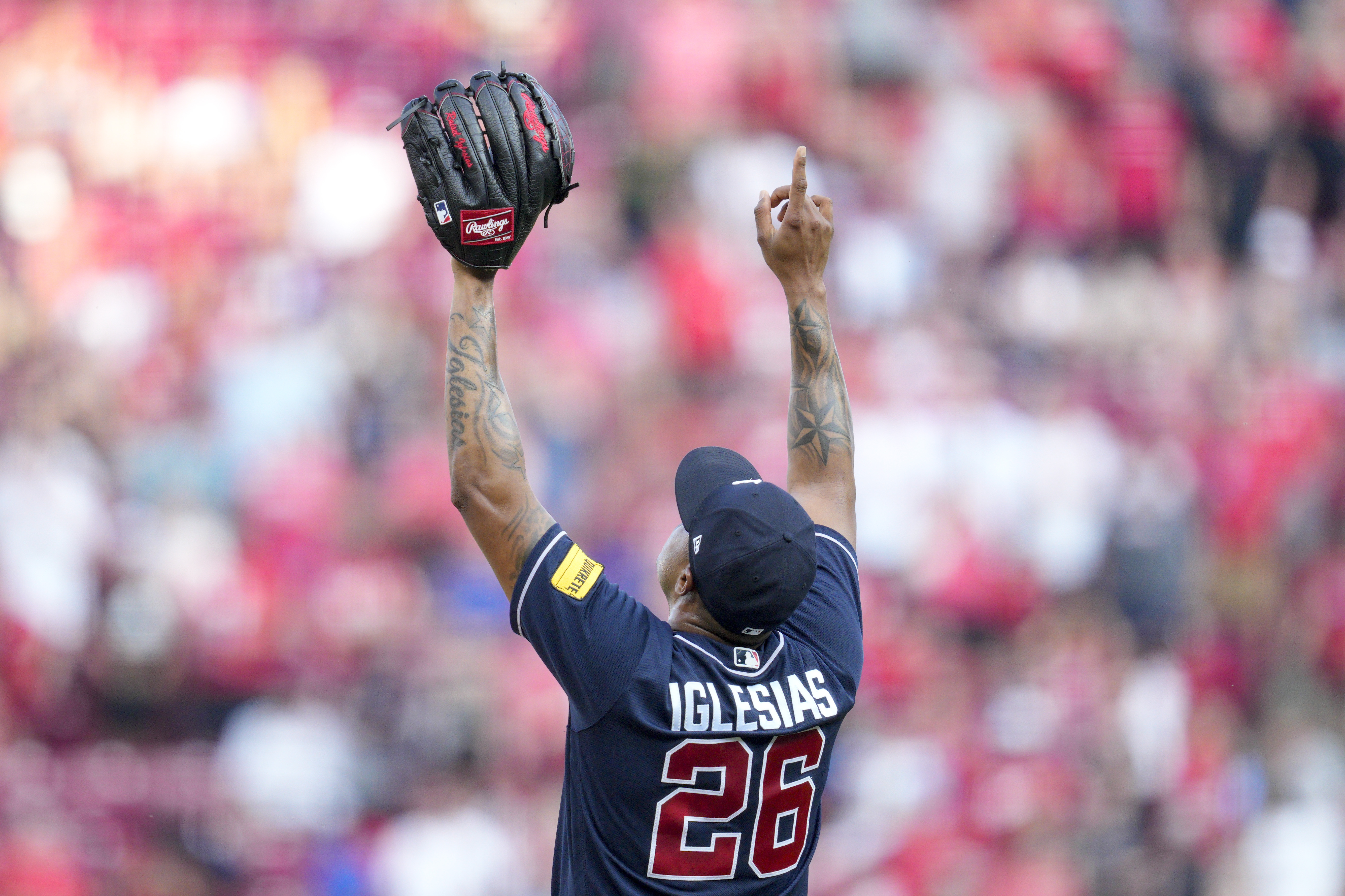 Atlanta Braves' Ozzie Albies (1) gets a hug from Orlando Arcia after hitting  a two-run home run in the fourth inning of a baseball game against the  Cincinnati Reds Tuesday, April 11