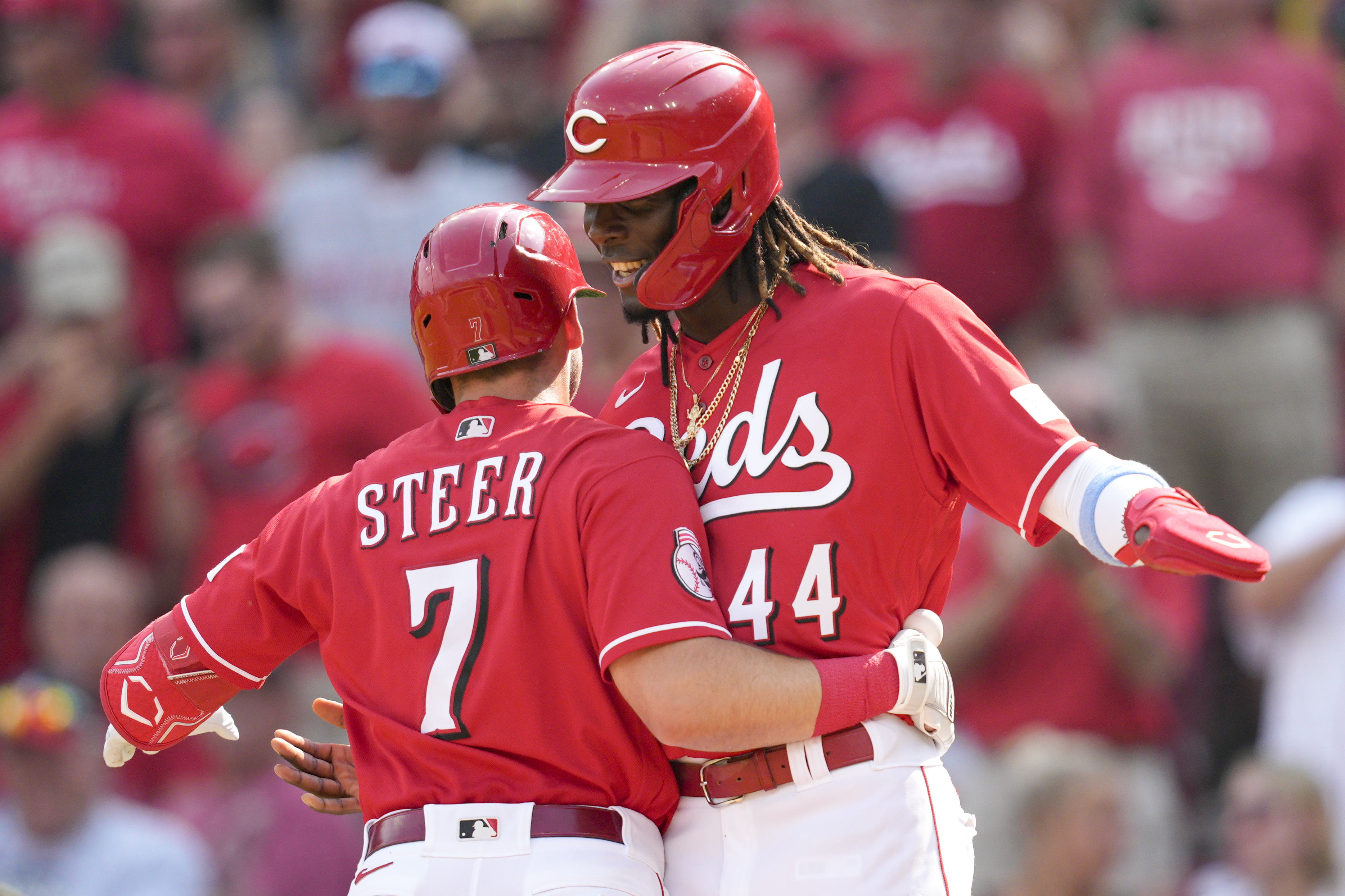 Atlanta Braves' Ozzie Albies (1) gets a hug from Orlando Arcia after hitting  a two-run home run in the fourth inning of a baseball game against the  Cincinnati Reds Tuesday, April 11