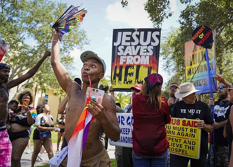 Keith Reeves stands in front of protestors just prior to the St. Pete Pride Parade on Saturday, June 24, 2023, in St. Petersburg, Fla. (Chloe Trofatter/Tampa Bay Times via AP)