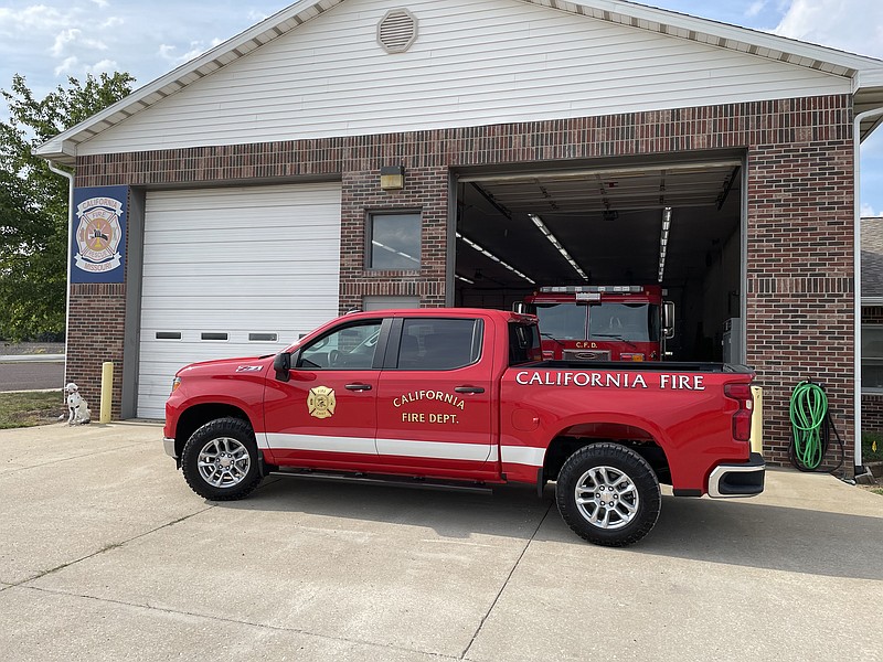 Submitted/ Courtesy of Brad Friedmeyer 
The California Fire Department parks its new fire chief vehicle 2023 Chevrolet Silverado 1500 in front of the fire house. Chief Brad Friedmeyer places new decals onto the pickup to prepare it for use in the community.