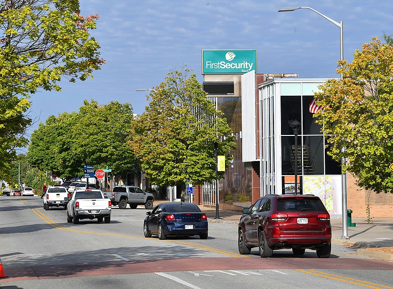Traffic passes Sept. 23 along Emma Avenue near Shiloh Square in downtown Springdale. Bond sales approved by the City Council on Tuesday would give the city $109 million for street projects. 
(File Photo/NWA Democrat-Gazette/Andy Shupe)