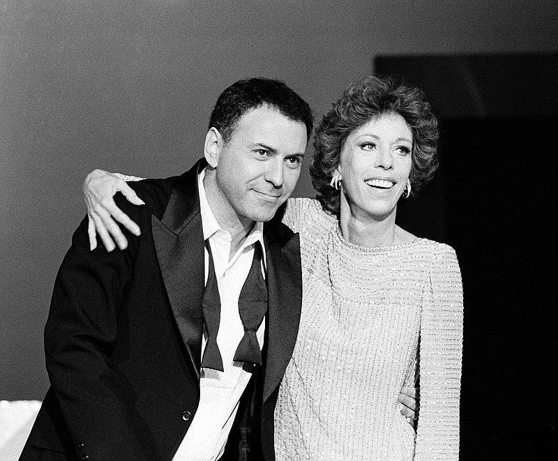 FILE - Comedian Carol Burnett and actor Alan Arkin appear during the filming of a special "Carol Burnett Show" in Los Angeles on Aug. 10, 1979. Arkin, the wry character actor who demonstrated his versatility in comedy and drama as he received four Academy Award nominations and won an Oscar in 2007 for "Little Miss Sunshine," has died. He was 89. (AP Photo/George Brich, File)