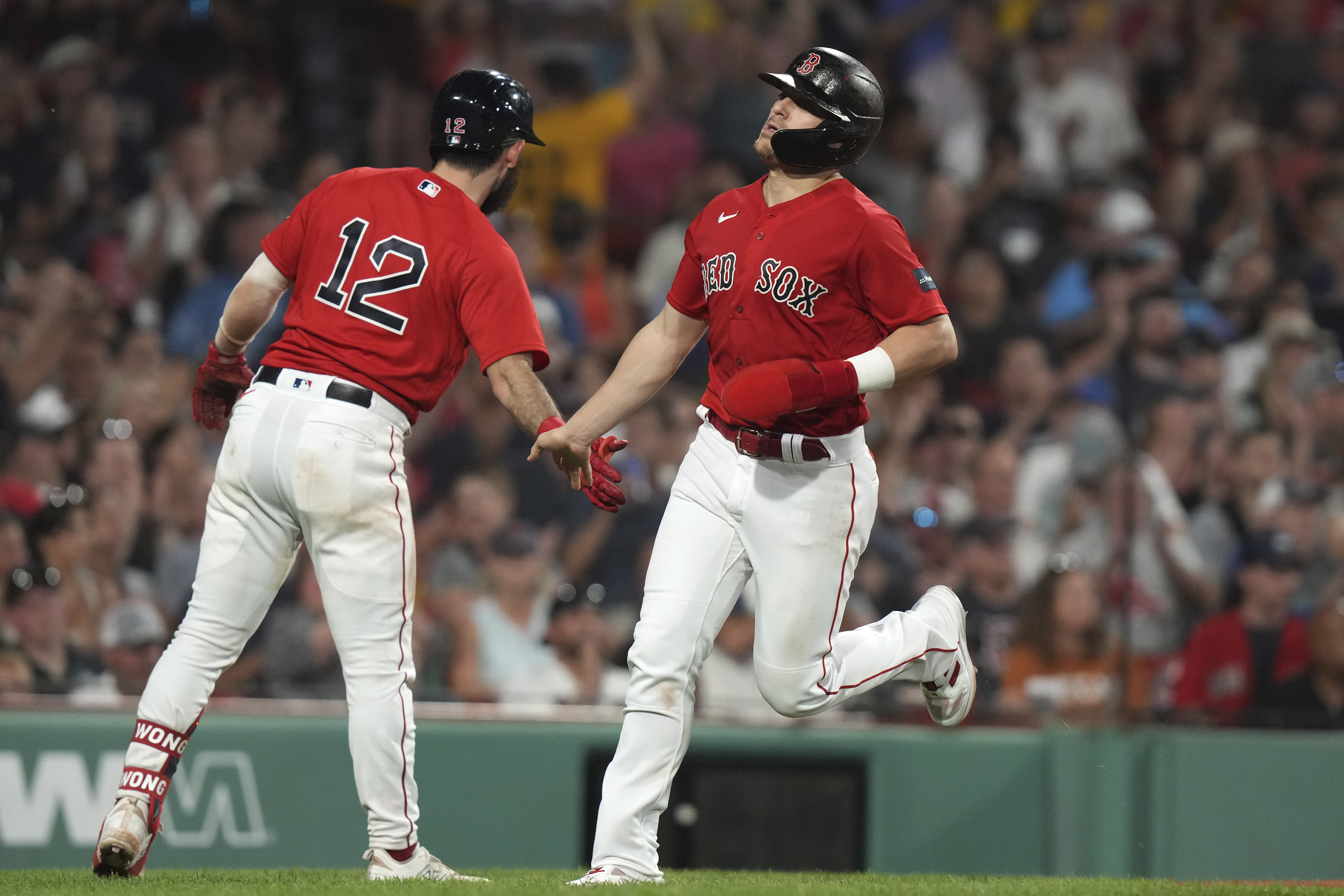 Boston Red Sox's Christian Arroyo hits a single in front of