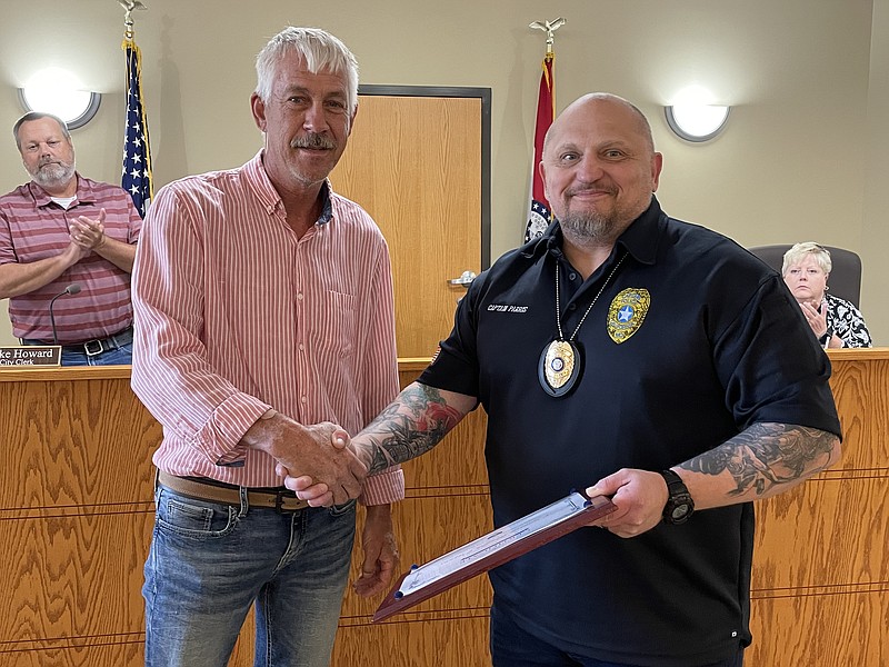 Democrat photo/Kaden Quinn 
Mayor Lanny Ash bestows California Police Capt. Ralph Parris with certificate commending him for his actions toward a civilian in distress.