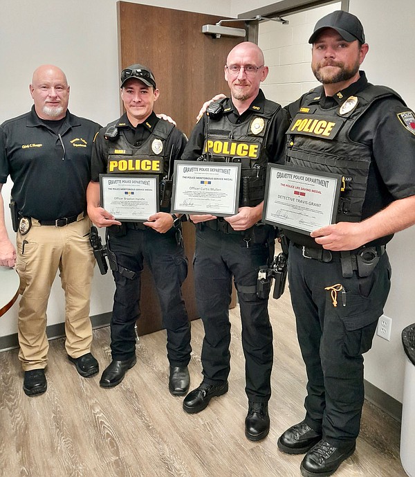 Three police officers honored at Committee of the Whole meeting
