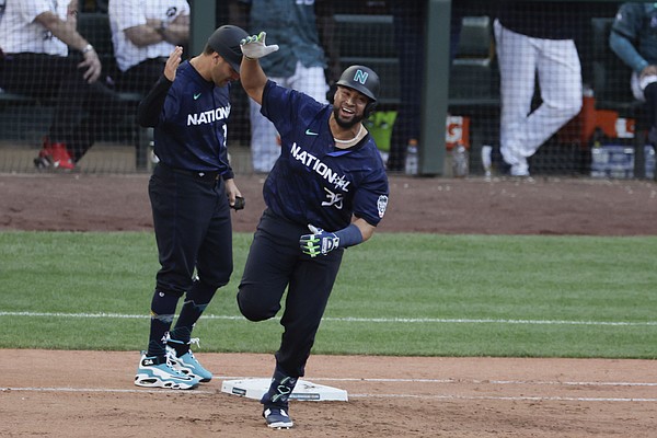 National League's Luis Arraez, of the Miami Marlins, hits an RBI single  during the fourth inning of the MLB All-Star baseball game in Seattle,  Tuesday, July 11, 2023. (AP Photo/John Froschauer Stock